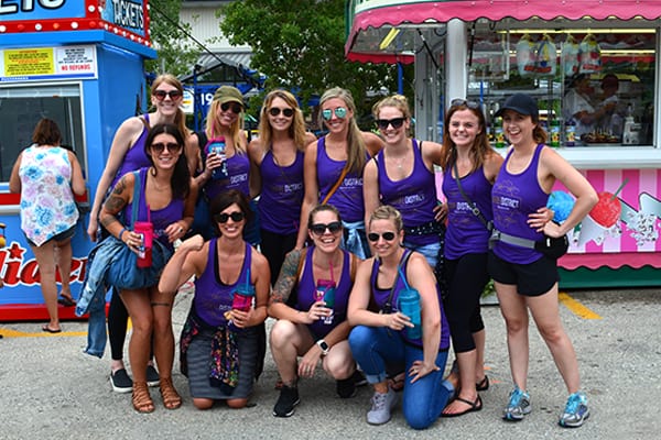 souvenir.cups Group of Fairgoers Holding Souvenir Cups